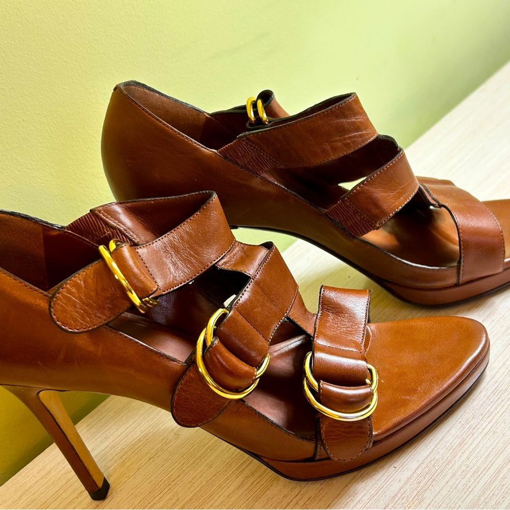 Cole Haan gorgeous brown heels with gold strap latches.